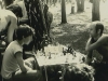 Chess tournament. A player at left is Dima Shwartzman; his adversary is unknown, unfortunately. Moscow, Ovrazhki forest, 1979. Photo by Michael Kremen. co RS