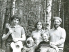 Rozenshtein family after performance of their older son Michael at the 1st Festival of Jewish Song. From the left: Michael, Natasha, Grigory. Younger Rozenshtein â Remka in the foreground, embracing his small friend. Moscow, Ovrazhki forest, Succot, 1977. Photo by Michael Kremen. co RS